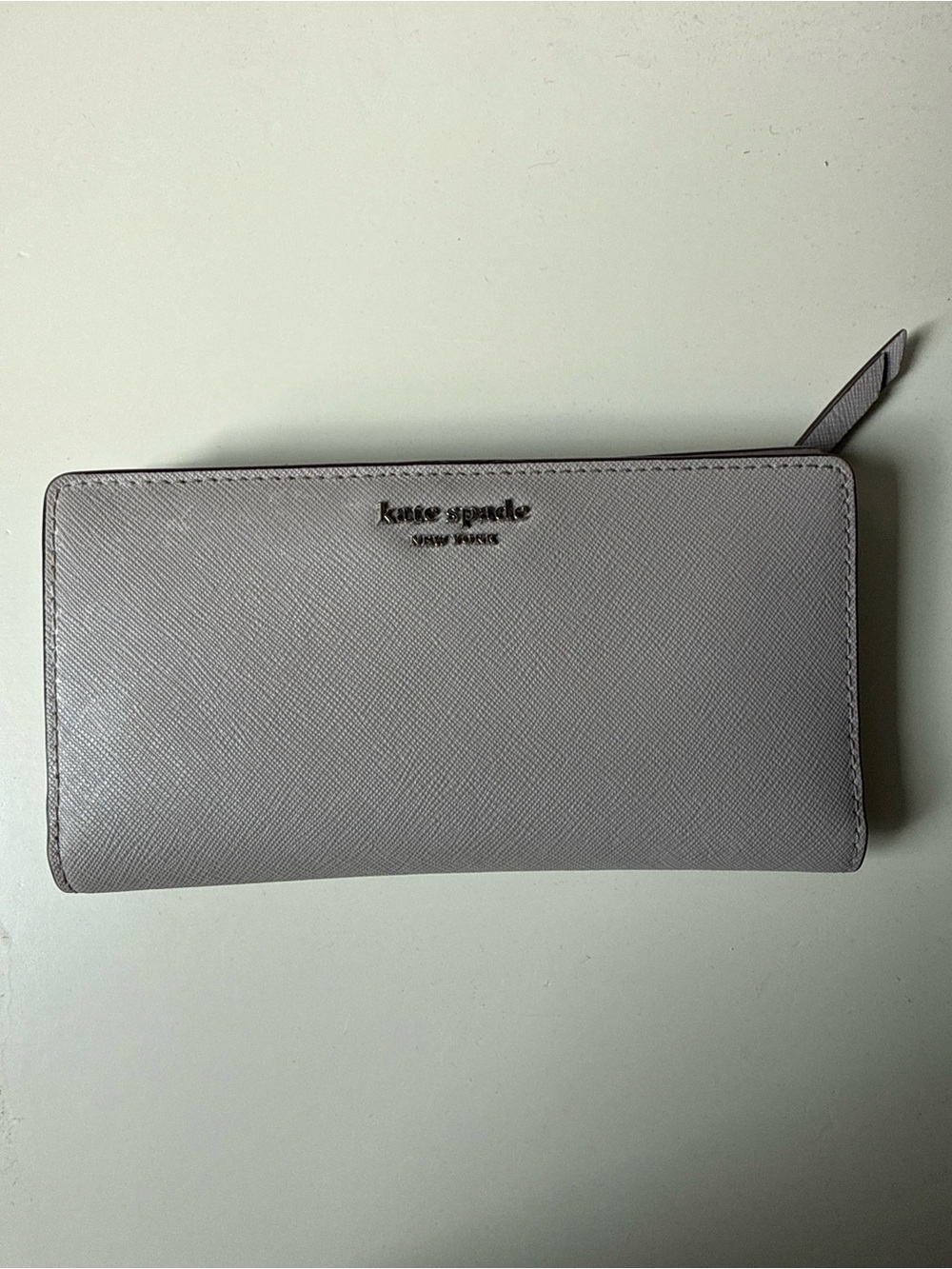 kate spade light gray wallet with silver hardware